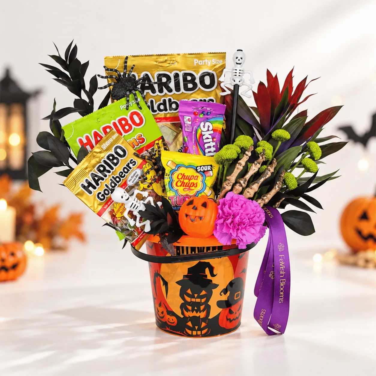 Halloween Candy & Fresh Flower Gift Bucket featuring colorful fresh flowers and sweet treats, perfect for Halloween gifting in Dubai.