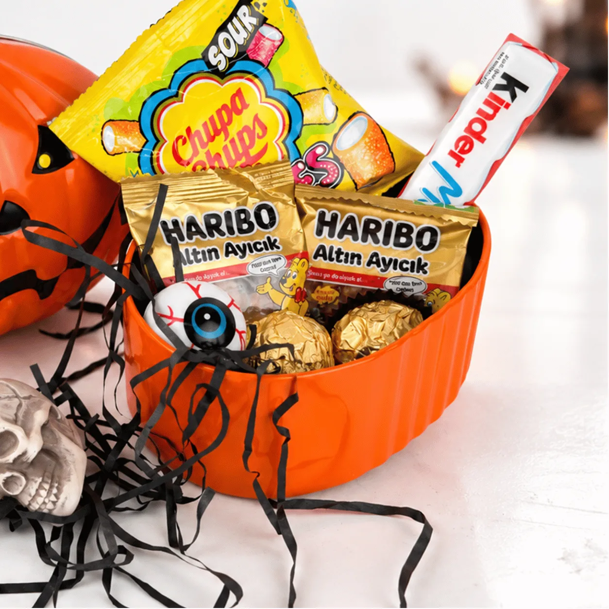 Side view of Sweet Frights Halloween Pumpkin Treat Box featuring a festive pumpkin-themed design and Halloween candy assortment.