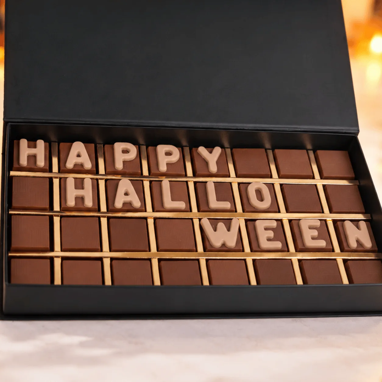 Side-angle view of Happy Halloween Premium Chocolate Gift Box showcasing its stylish festive packaging and premium chocolate selection.
