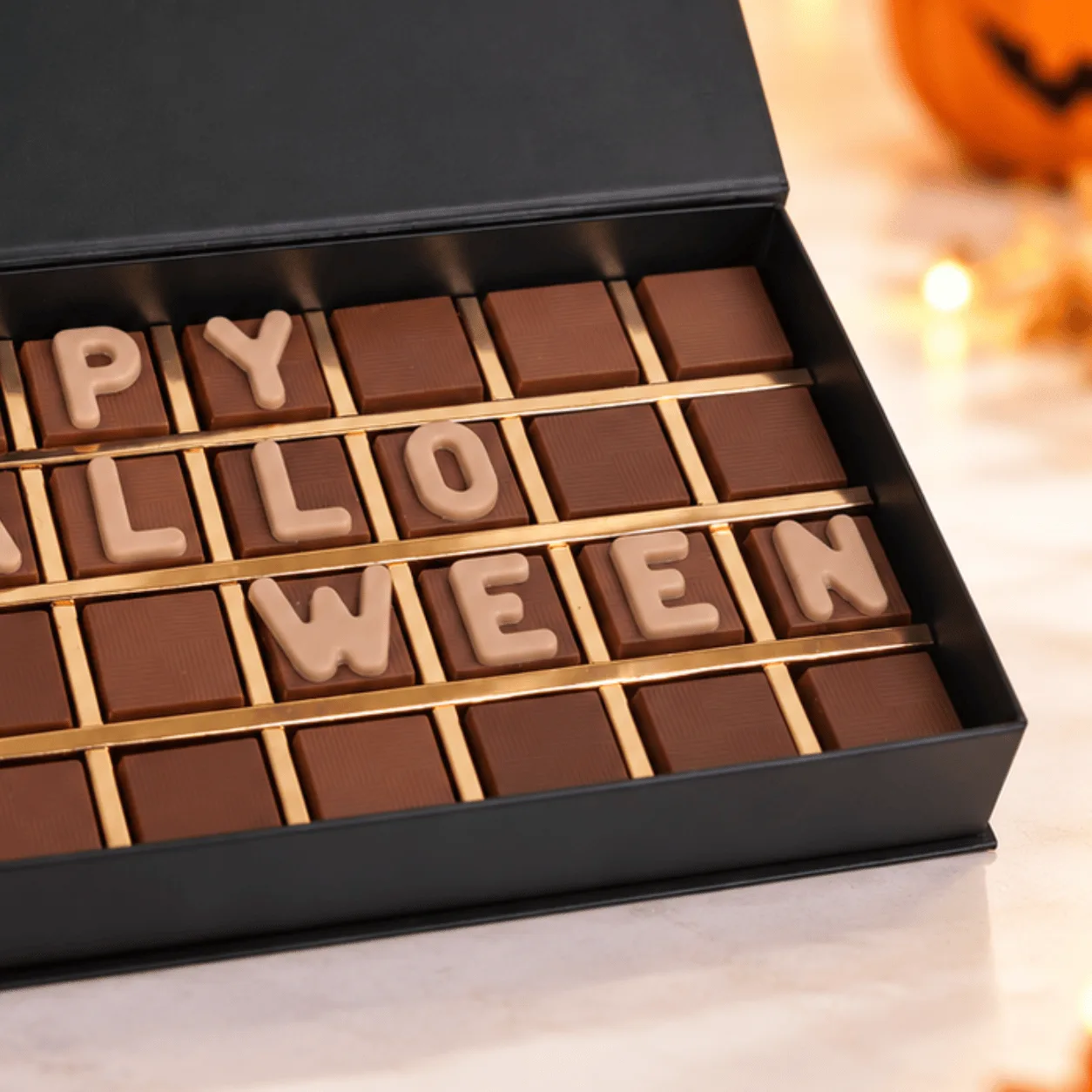Close-up of Happy Halloween Premium Chocolate Gift Box highlighting delicious assorted chocolates and elegant Halloween gift box details.