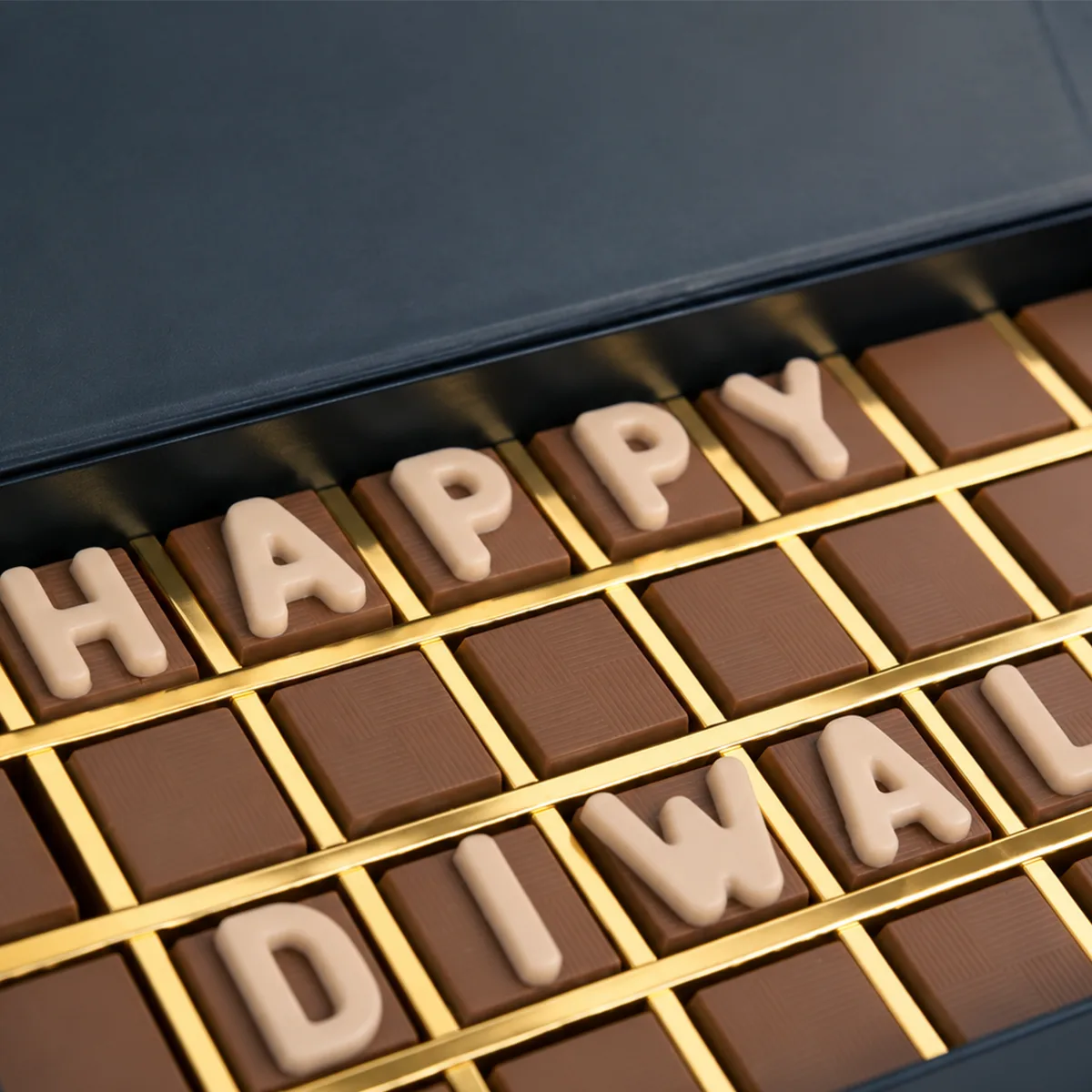 Close-up view of premium assorted chocolates beautifully arranged inside the Happy Diwali Chocolate Gift Box.