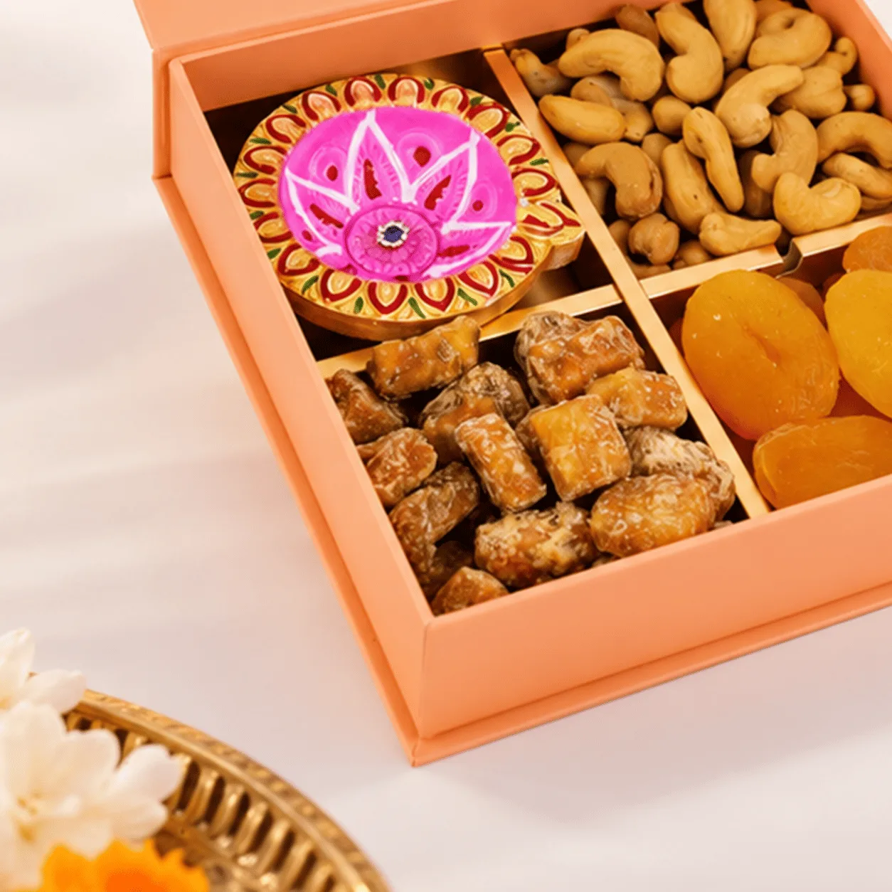 Diwali Dry Fruits & Diya Gift Box showcasing assorted dry fruits, traditional diyas, and festive gift presentation in Dubai.