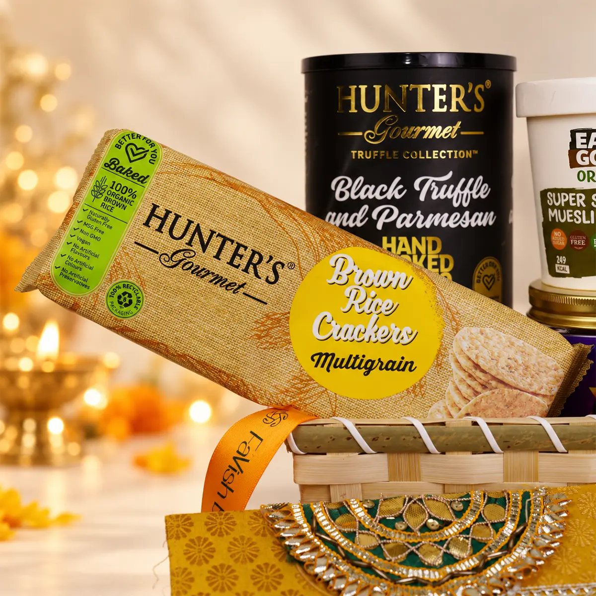 Premium Diwali hamper featuring Hunter's Gourmet brown rice crackers and black truffle chips.