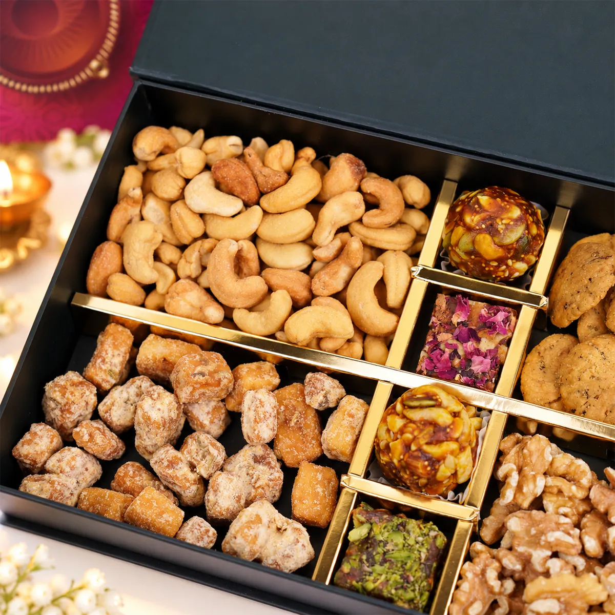 Luxury Diwali gift box with cashews, gurpara, walnuts, and assorted dry fruit sweets.