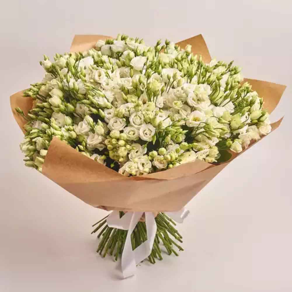 Elegant white lisianthus bouquet wrapped in kraft paper with a white ribbon