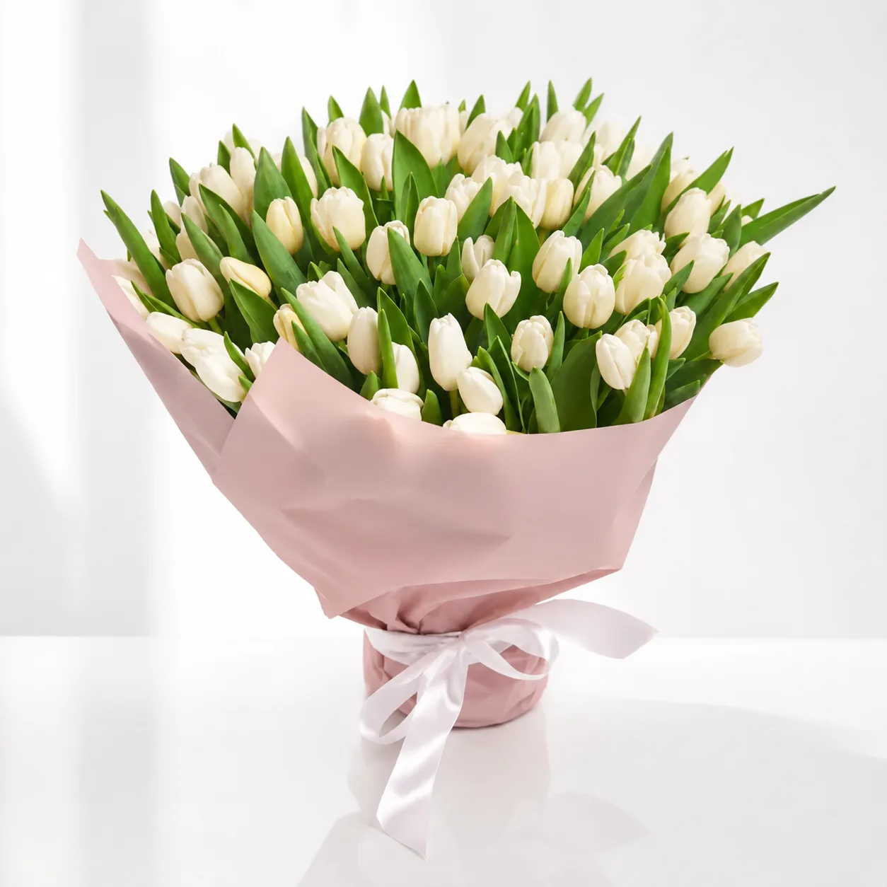 Premium white tulip bouquet with 75 fresh blooms by FaVish Blooms