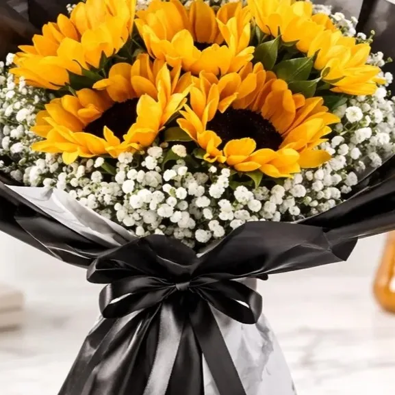 Sunshine Elegance fresh yellow flower arrangement with luxury wrapping by FaVish Blooms.