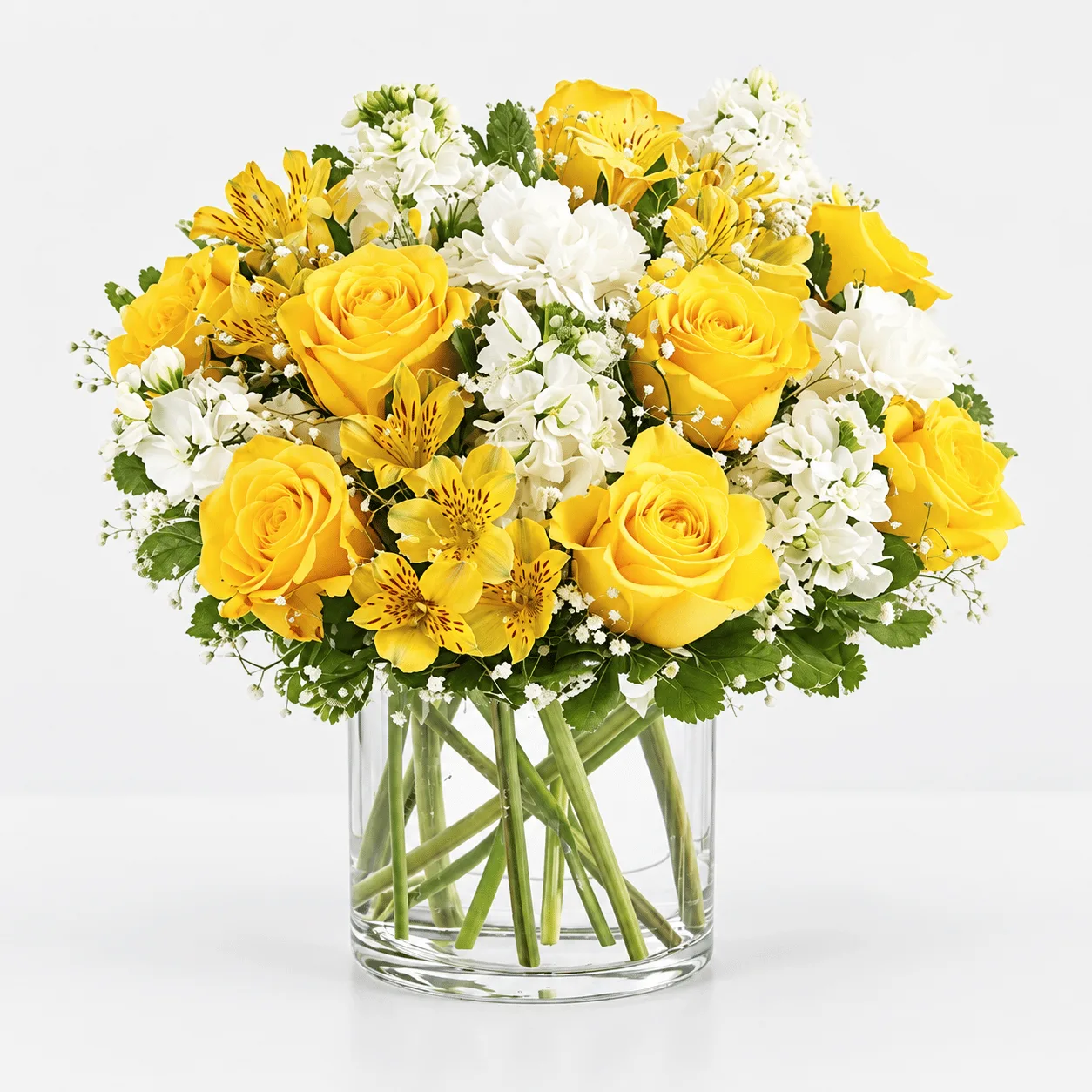 Luxury yellow and white flower vase arrangement for birthdays, congratulations and special occasions in Dubai.