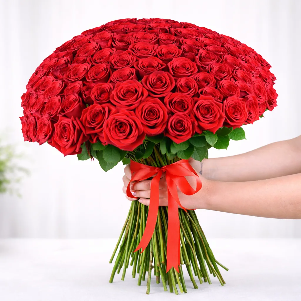 Close-up large round red rose bouquet tied with ribbon