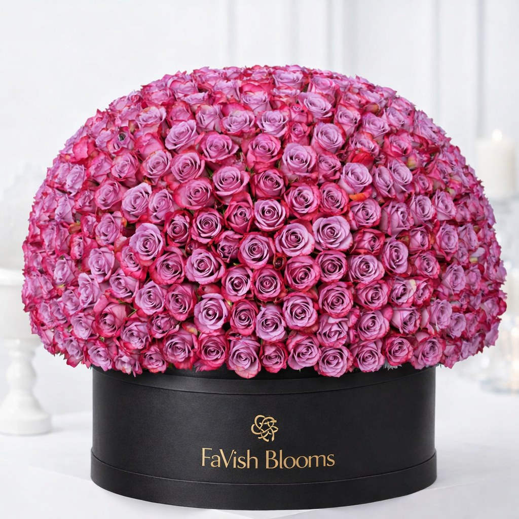 Dome arrangement of pink roses in black luxury flower box