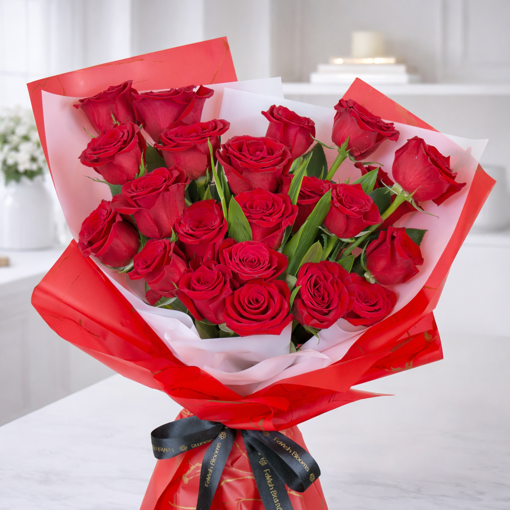 Close-up of fresh red roses bouquet wrapped in red paper