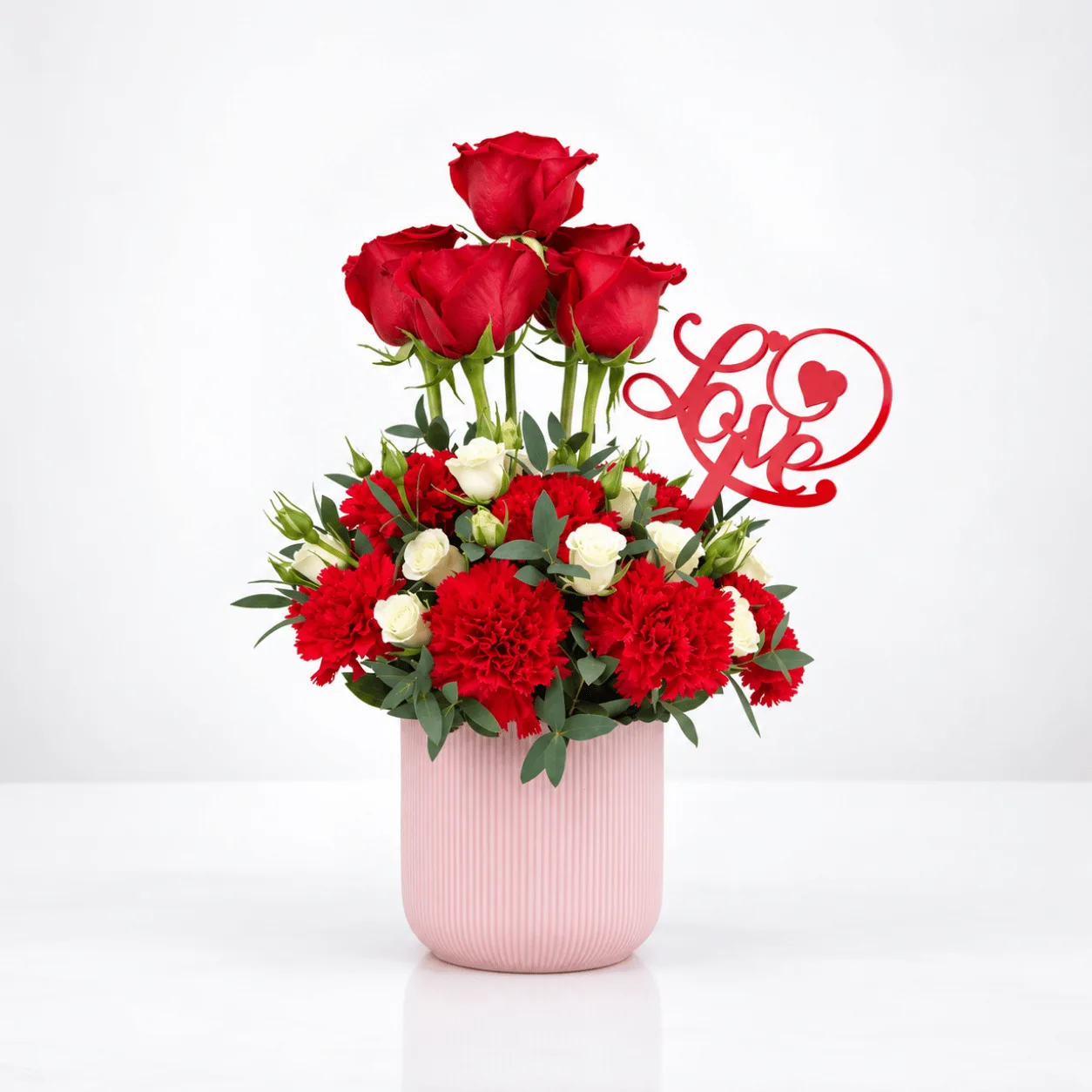 Crown Love arrangement featuring 21 red and white flowers with an elegant love topper.