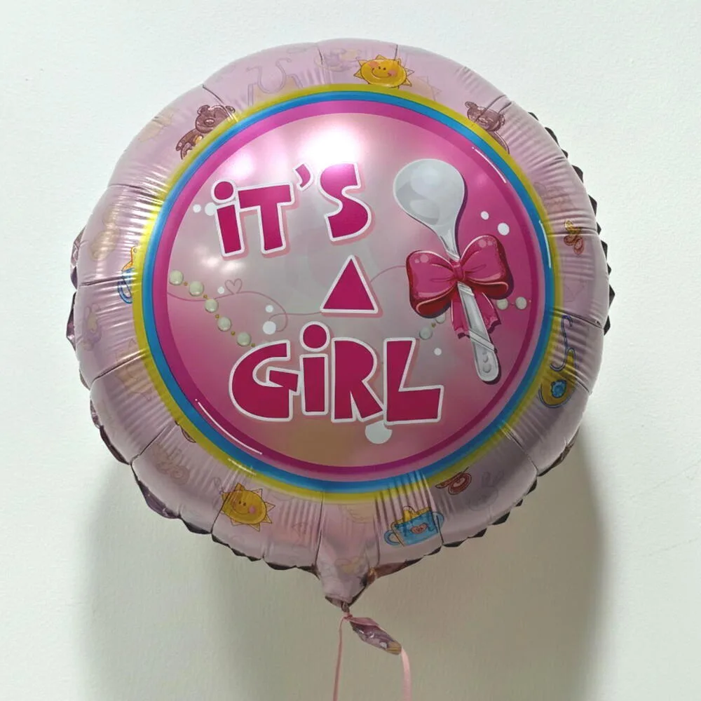 Pink 'It's a Girl' foil balloon with baby rattle and bow design.