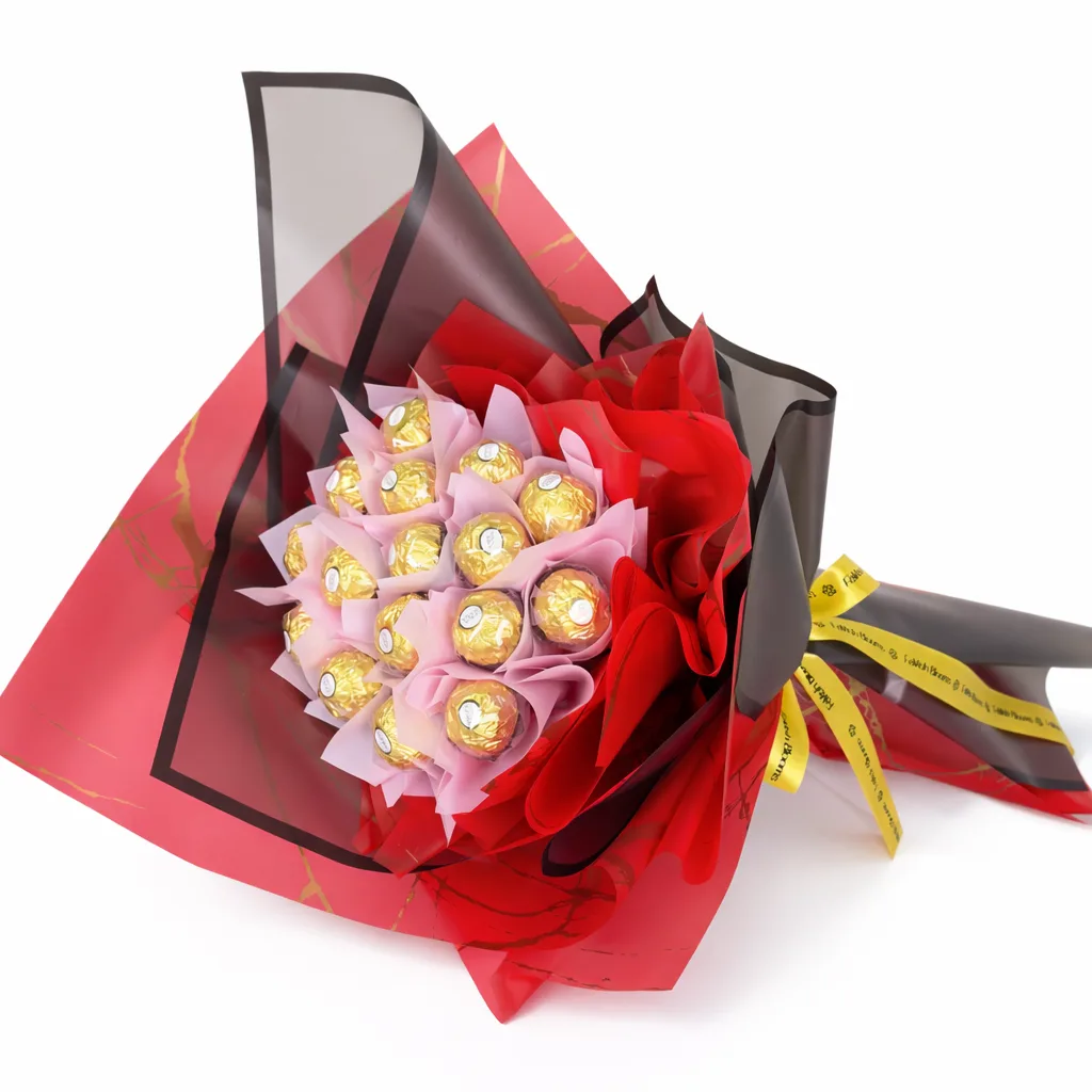 Overhead view of a Ferrero Rocher chocolate bouquet in red and black wrapping with a gold ribbon.