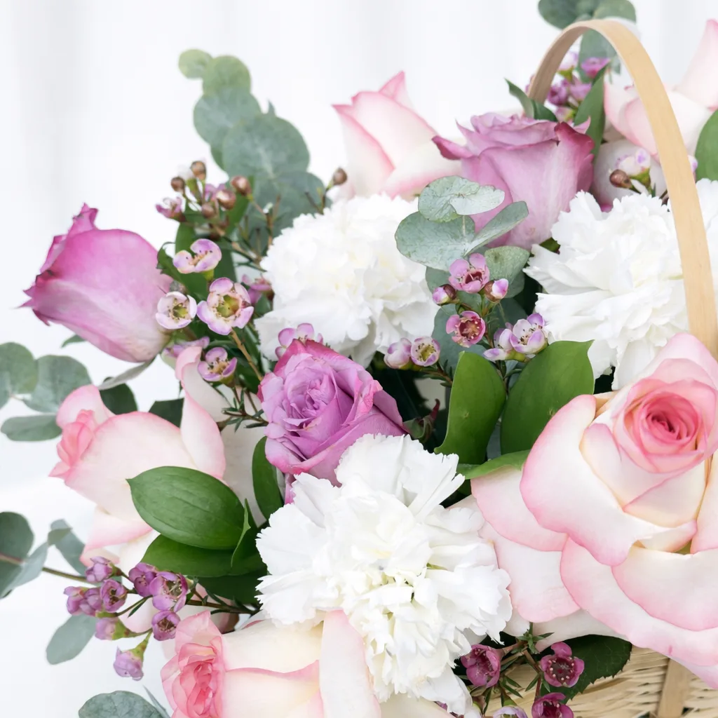 A gorgeous close-up showing the detail — the wax flowers' tiny centers, the layered rose petals, and the fluffy white carnations are especially stunning up close! 🌷