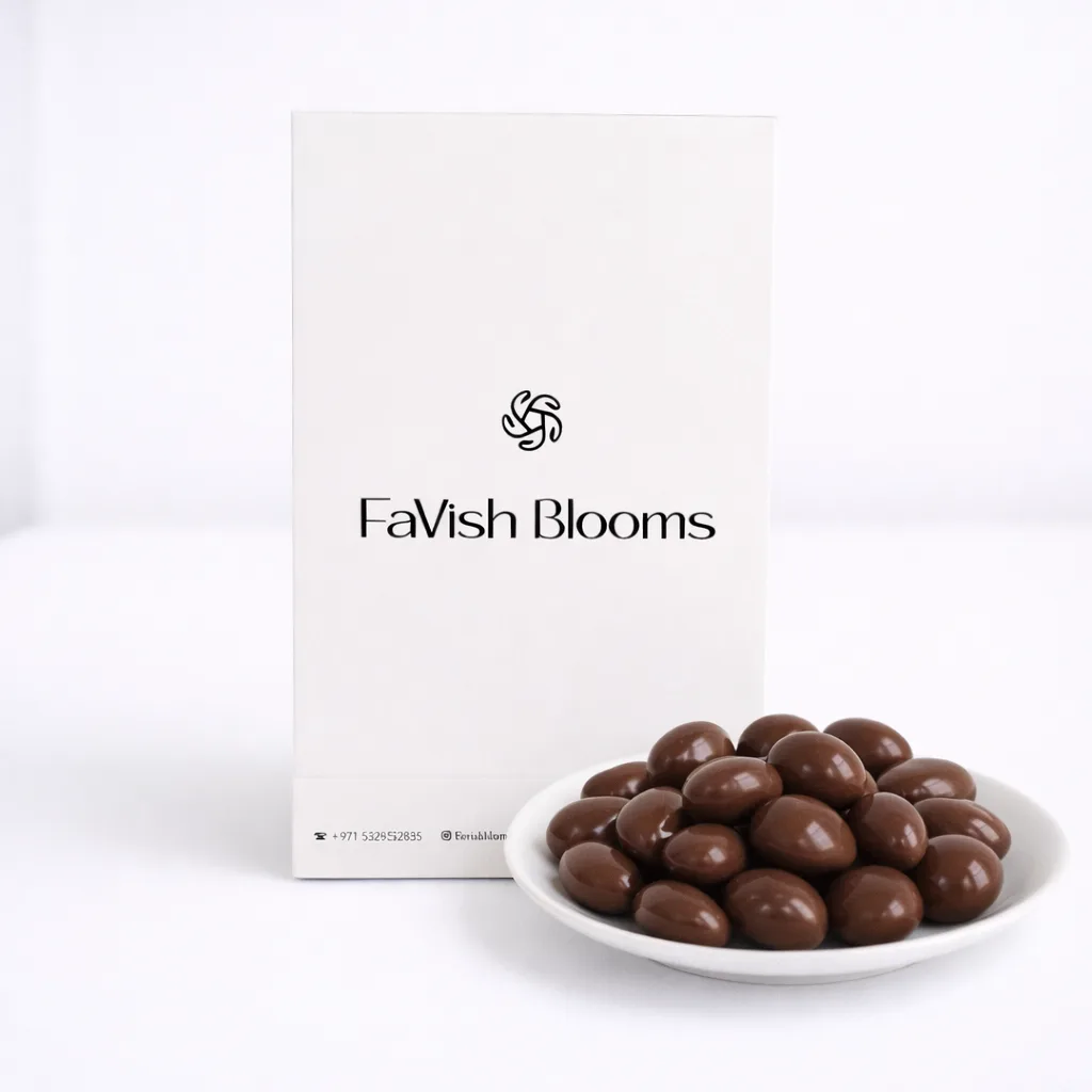 Plate of milk chocolate almonds next to a FaVish Blooms branded white box