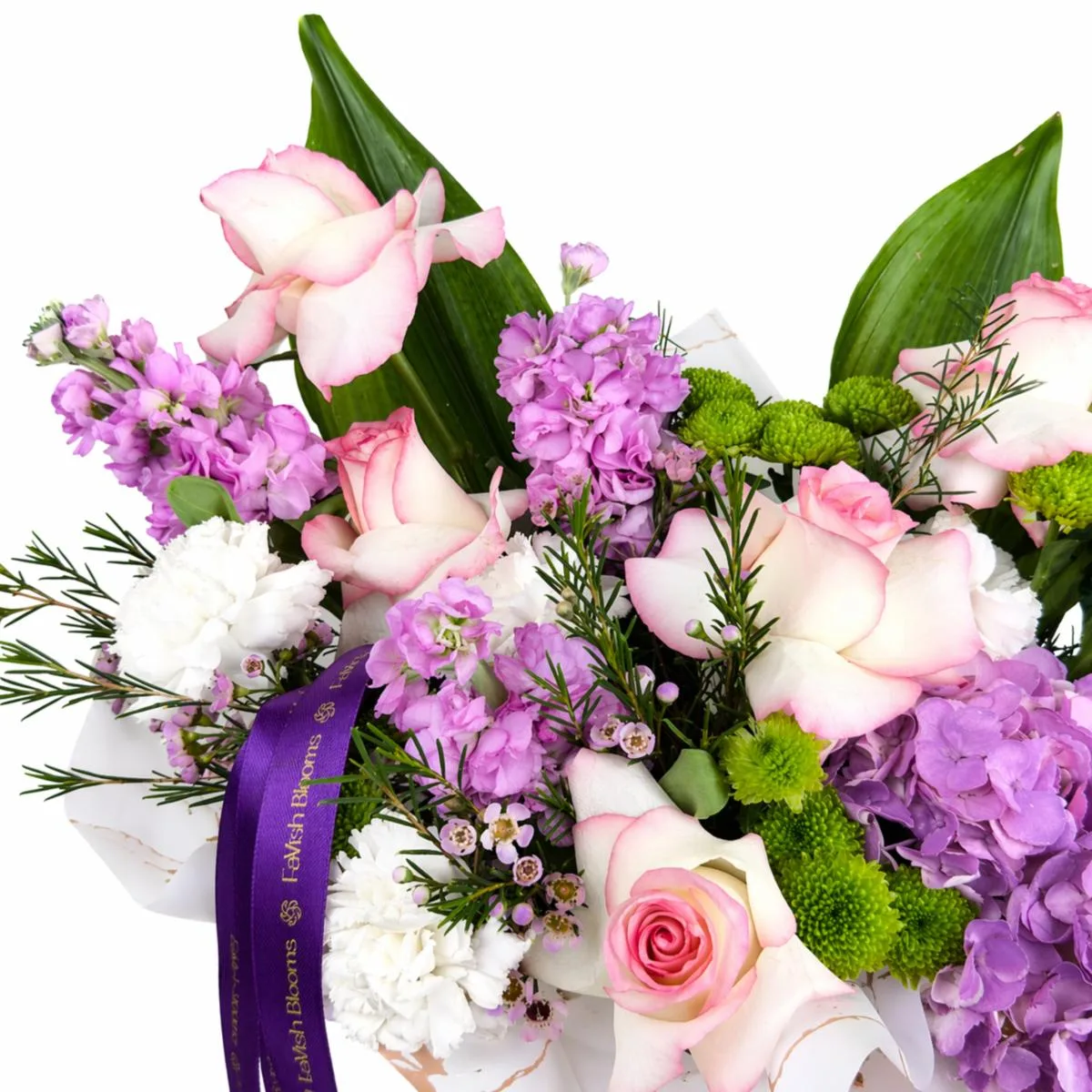 Close-up of a pink and purple floral arrangement with roses, hydrangeas, and stock flowers, tied with a purple satin ribbon.