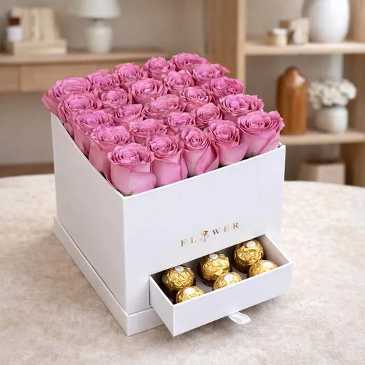 Pink rose and Ferrero Rocher gift box arrangement in a white drawer box.