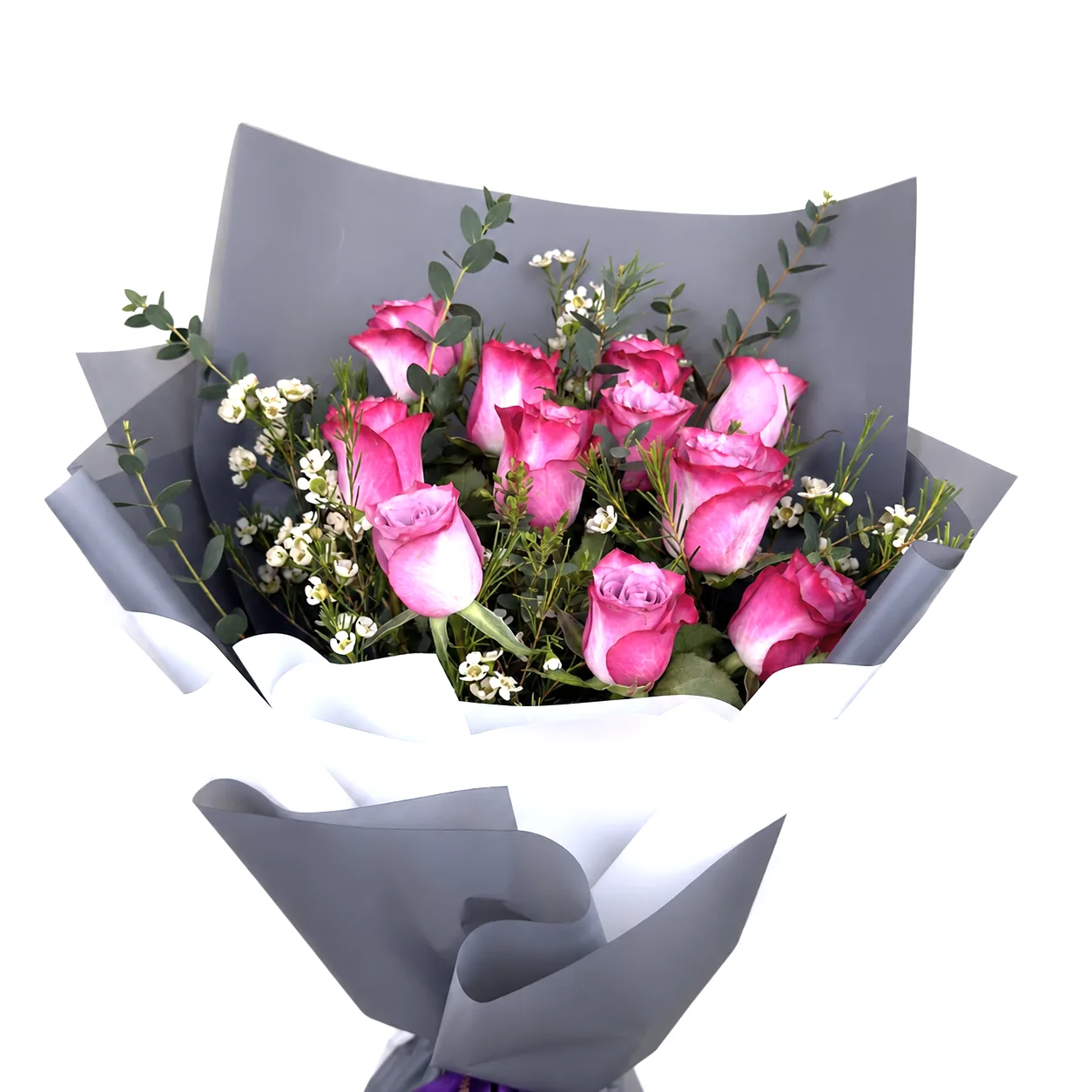 Pink roses bouquet with white fillers and greenery in grey wrapping.