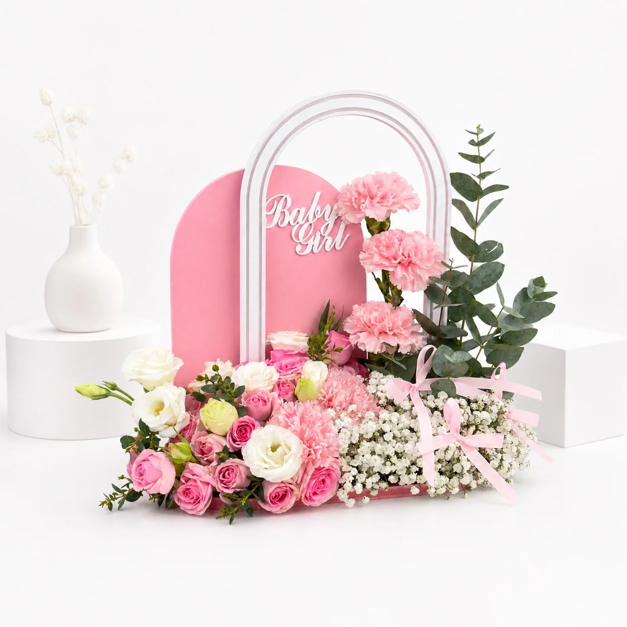 Baby Girl welcome floral arrangement with pink flowers