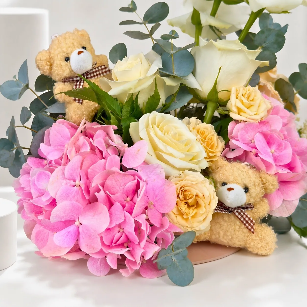 Pink hydrangea and white rose baby girl gift tray with teddy bears