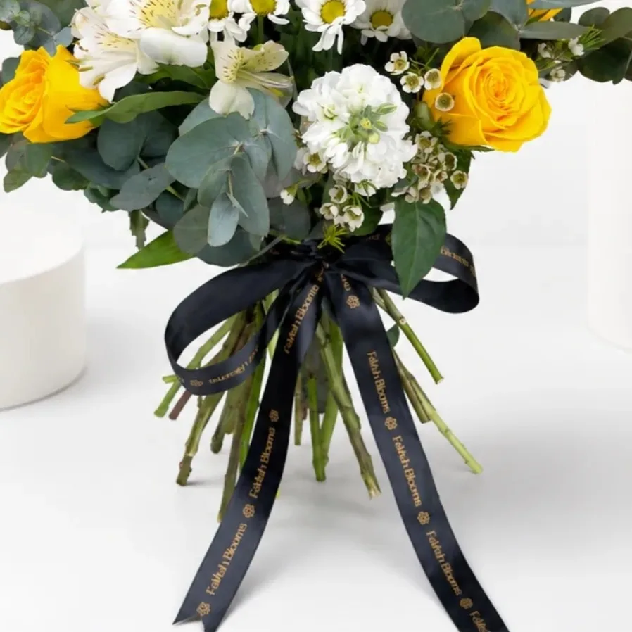 Sunshine Daisy & Rose Bouquet featuring yellow roses, white daisies, lilies, and eucalyptus in a vibrant mixed floral arrangement