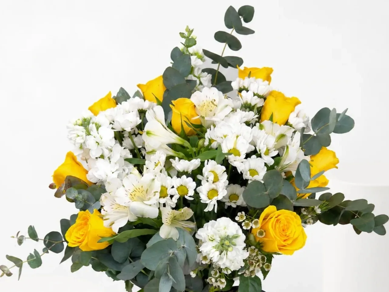 Sunshine Daisy & Rose Bouquet with yellow roses, white daisies, lilies, and eucalyptus in a fresh floral arrangement