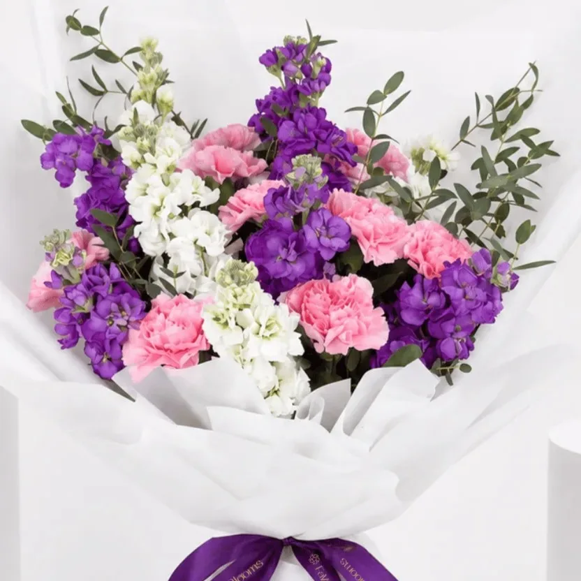 Pastel Matthiola Carnation Bouquet with soft pink, lavender, and white blooms arranged with fresh greenery.