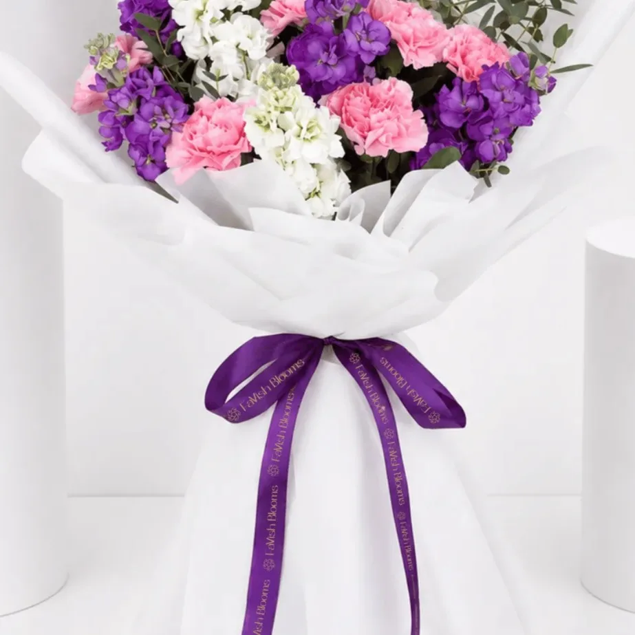 Elegant pastel bouquet featuring matthiola, carnations, and delicate seasonal flowers for a soft floral gift.