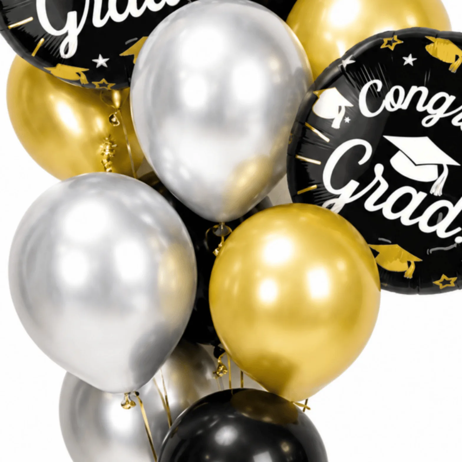 Close-up of gold, silver and black Congrats Grad helium balloons with graduation foil balloon details.