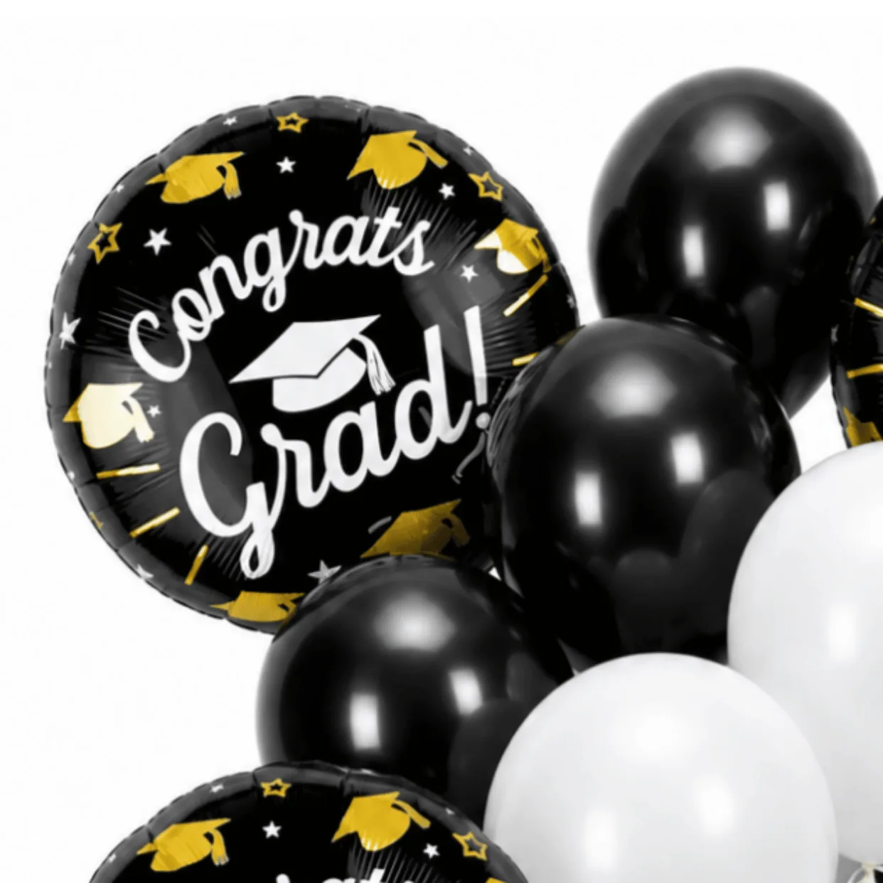Close-up of black and white Congrats Grad helium balloon bouquet with graduation foil balloons.