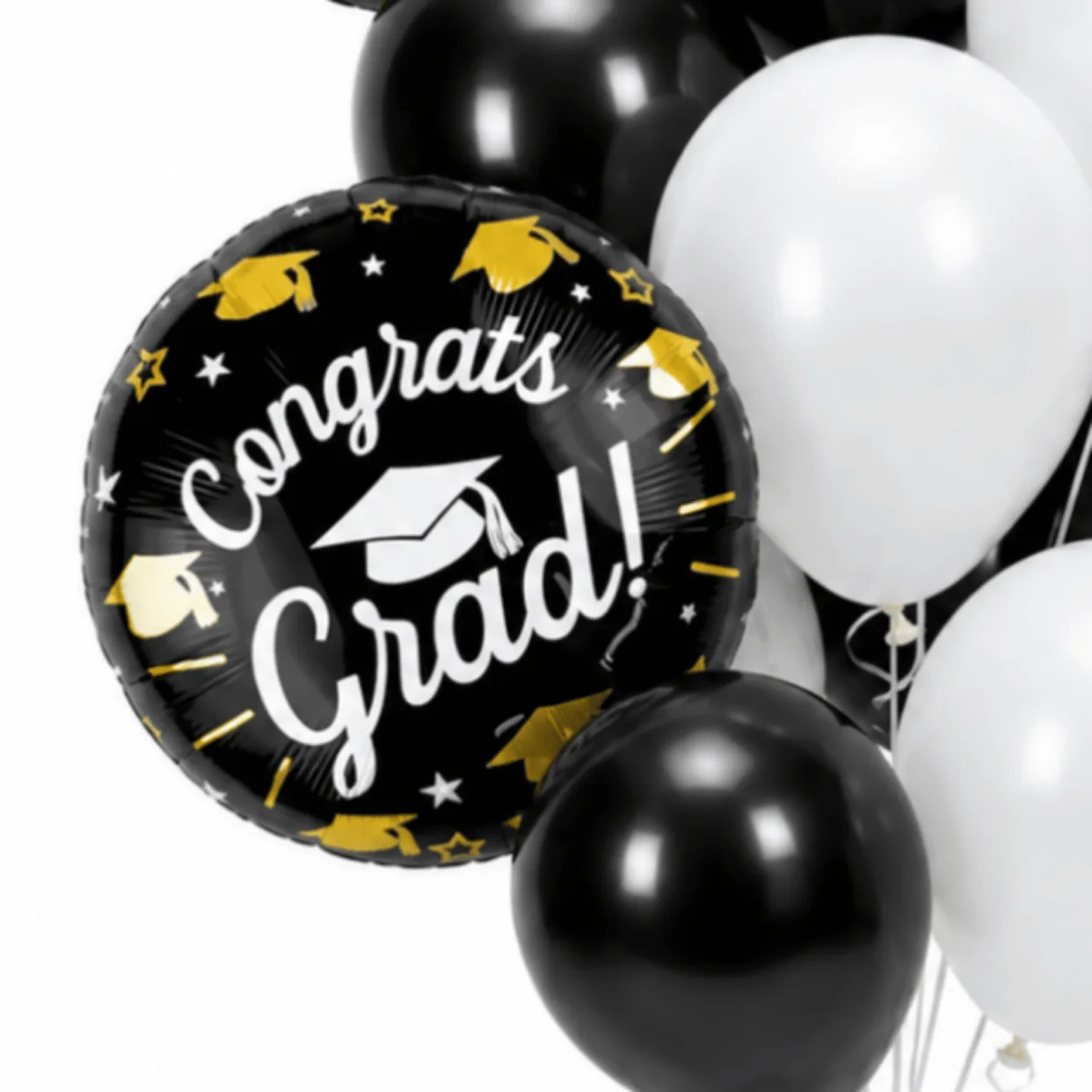 Close-up of black and white Congrats Grad helium balloon bouquet with graduation cap foil balloon design