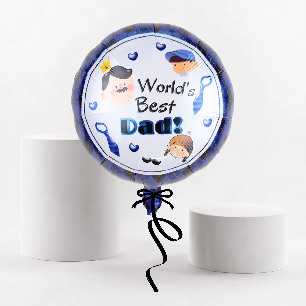 World’s Best Dad helium foil balloon with blue border and black ribbon on a white display setup.