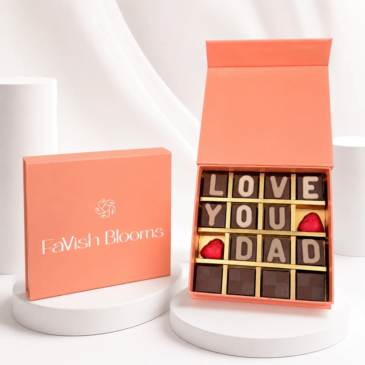 Love You Dad luxury chocolate box in peach FaVish Blooms packaging on a premium white display setup.