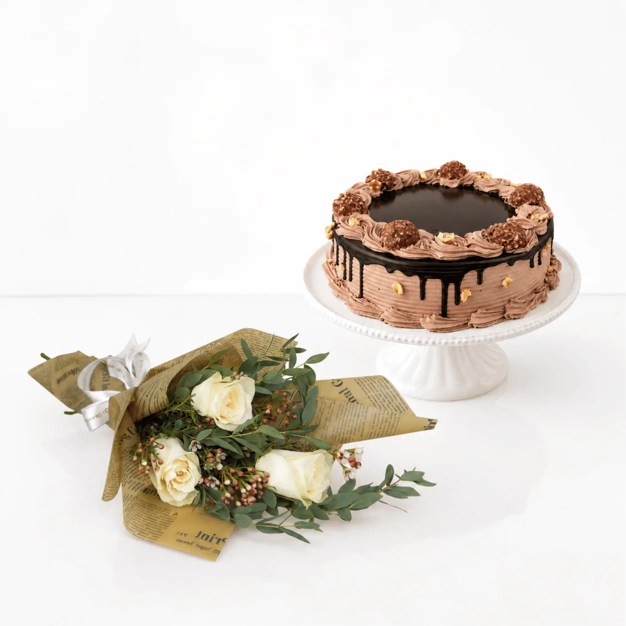 Ferrero Rocher Cake and White Rose Bouquet Combo for elegant celebrations