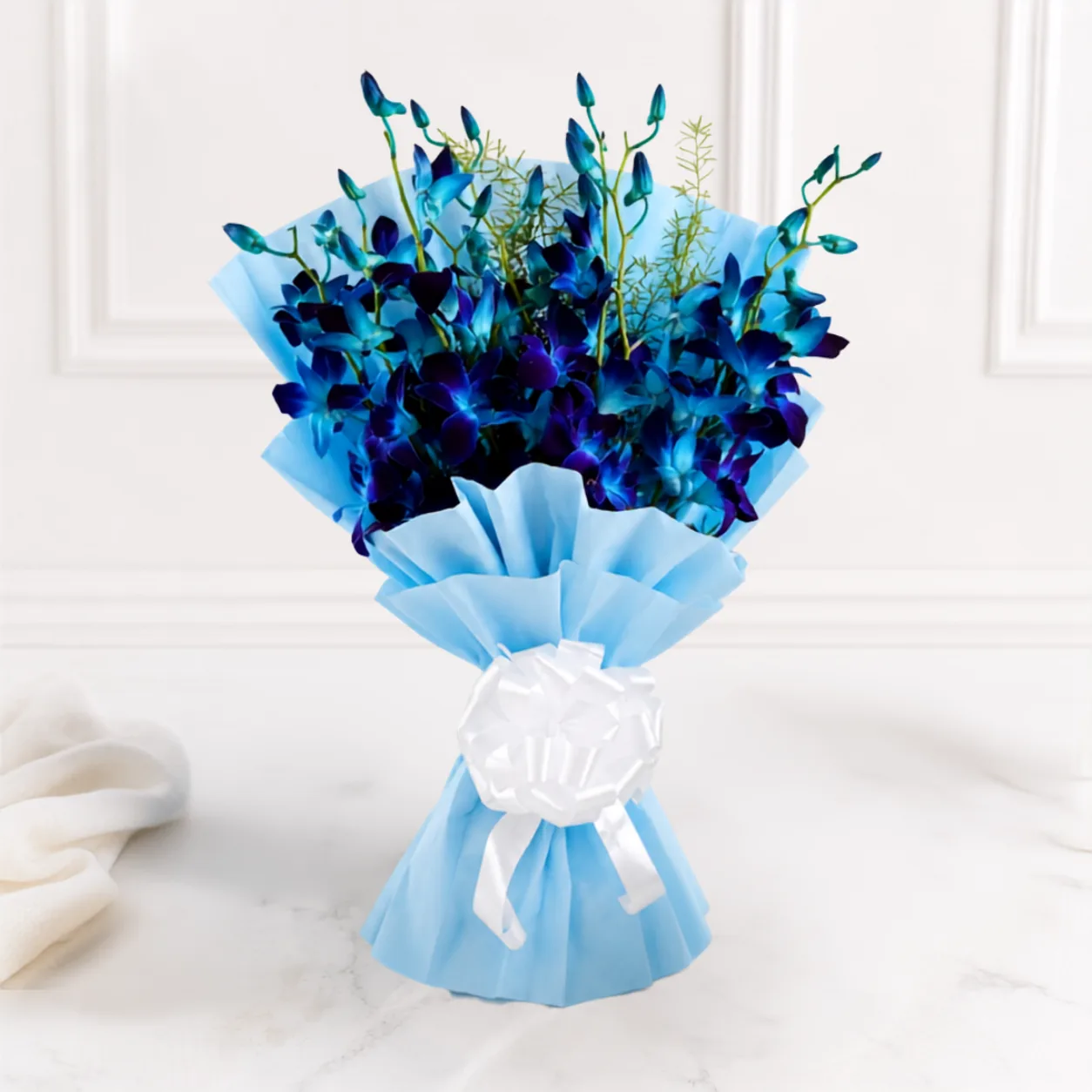 Premium blue orchid bouquet with pistachio chocolate drip cake by FaVish Blooms Dubai