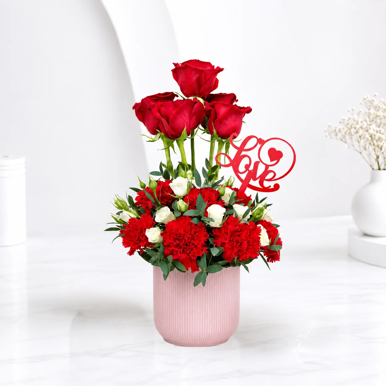 Premium chocolate truffle cake with fresh red rose bouquet by FaVish Blooms Dubai