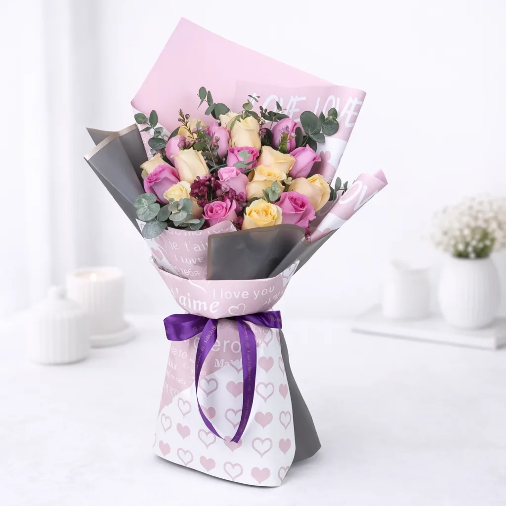 Fudge brownie chocolate cake with peach pink rose bouquet for luxury gifting