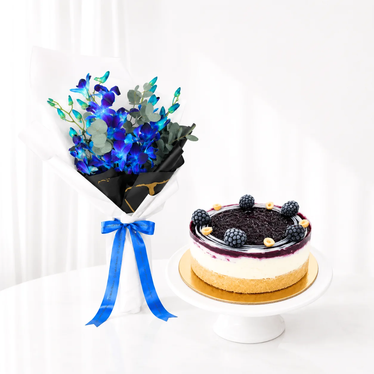 Blue Orchid Bouquet and Blueberry Dream Cheesecake Combo for birthdays and celebrations