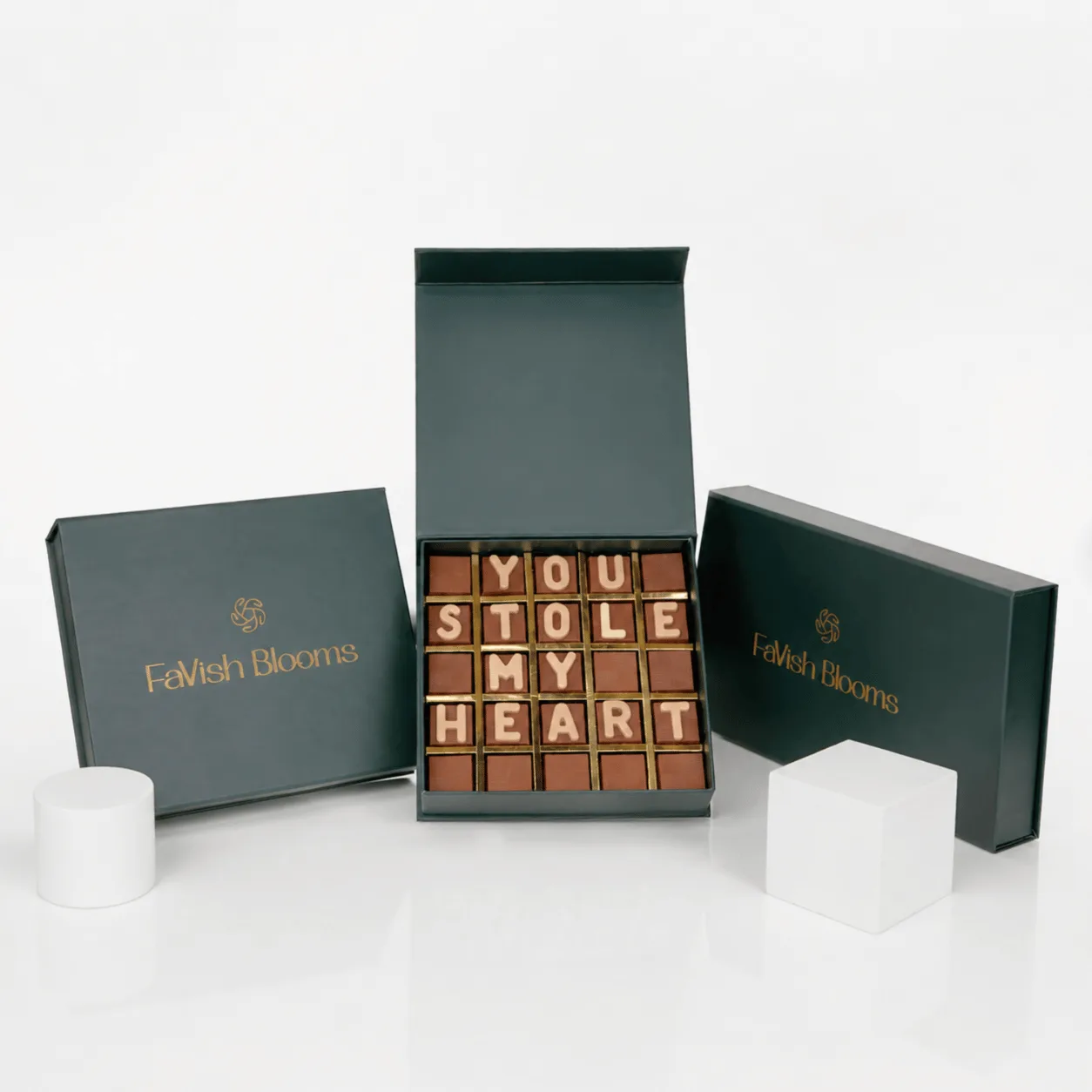 "Chocolate letter box spelling 'You Stole My Heart' in a green FaVish Blooms gift box."