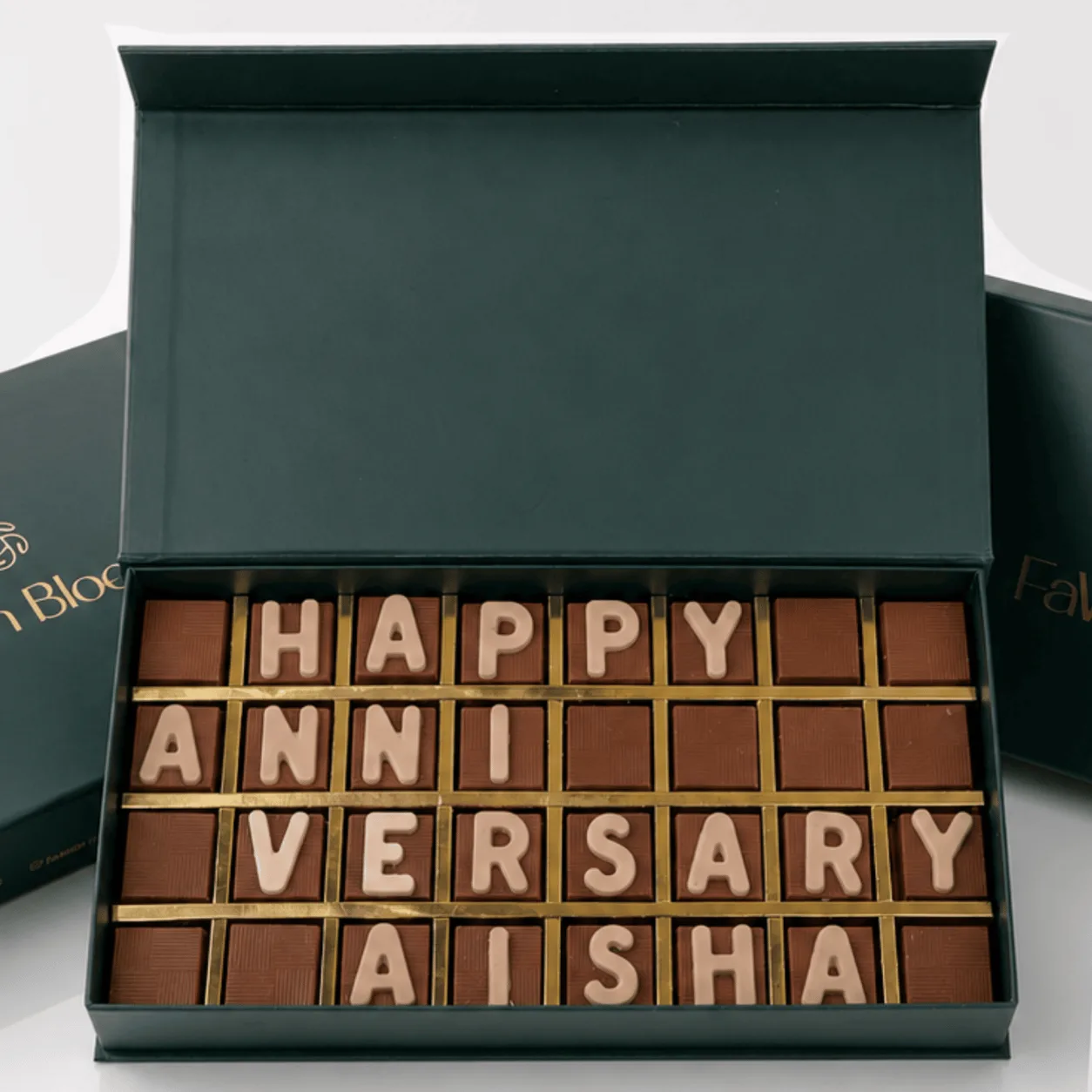 Close-up of personalized "Happy Anniversary" chocolate letter box