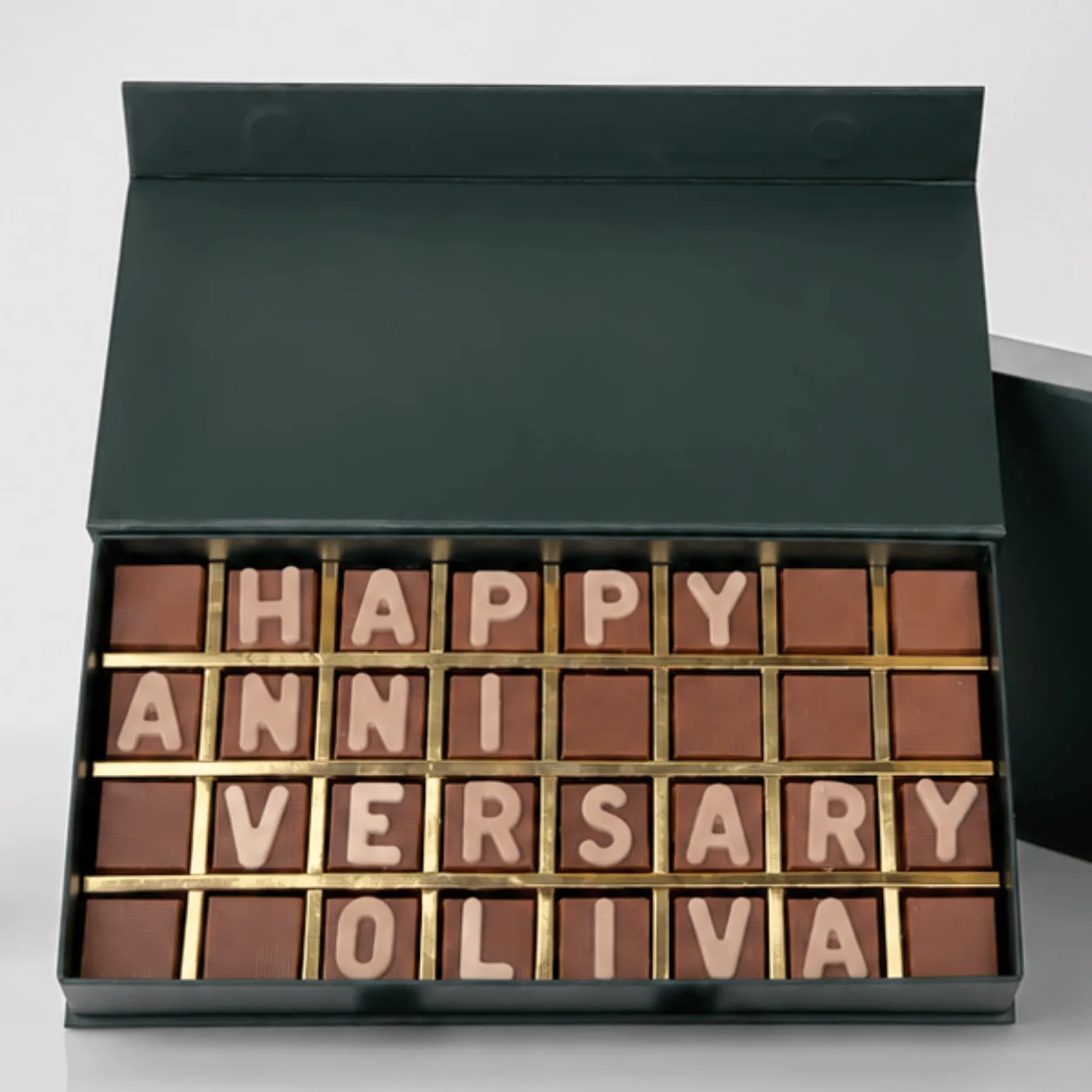 Close-up of personalized "Happy Anniversary" chocolate letter box