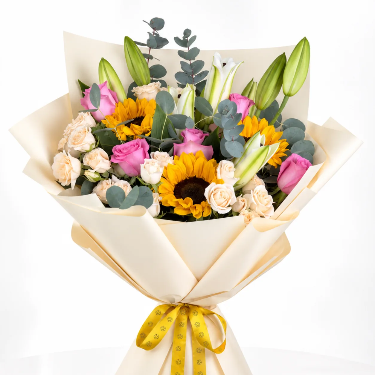 Sunflower and pink rose bouquet with white lilies, cream wrapping, yellow ribbon