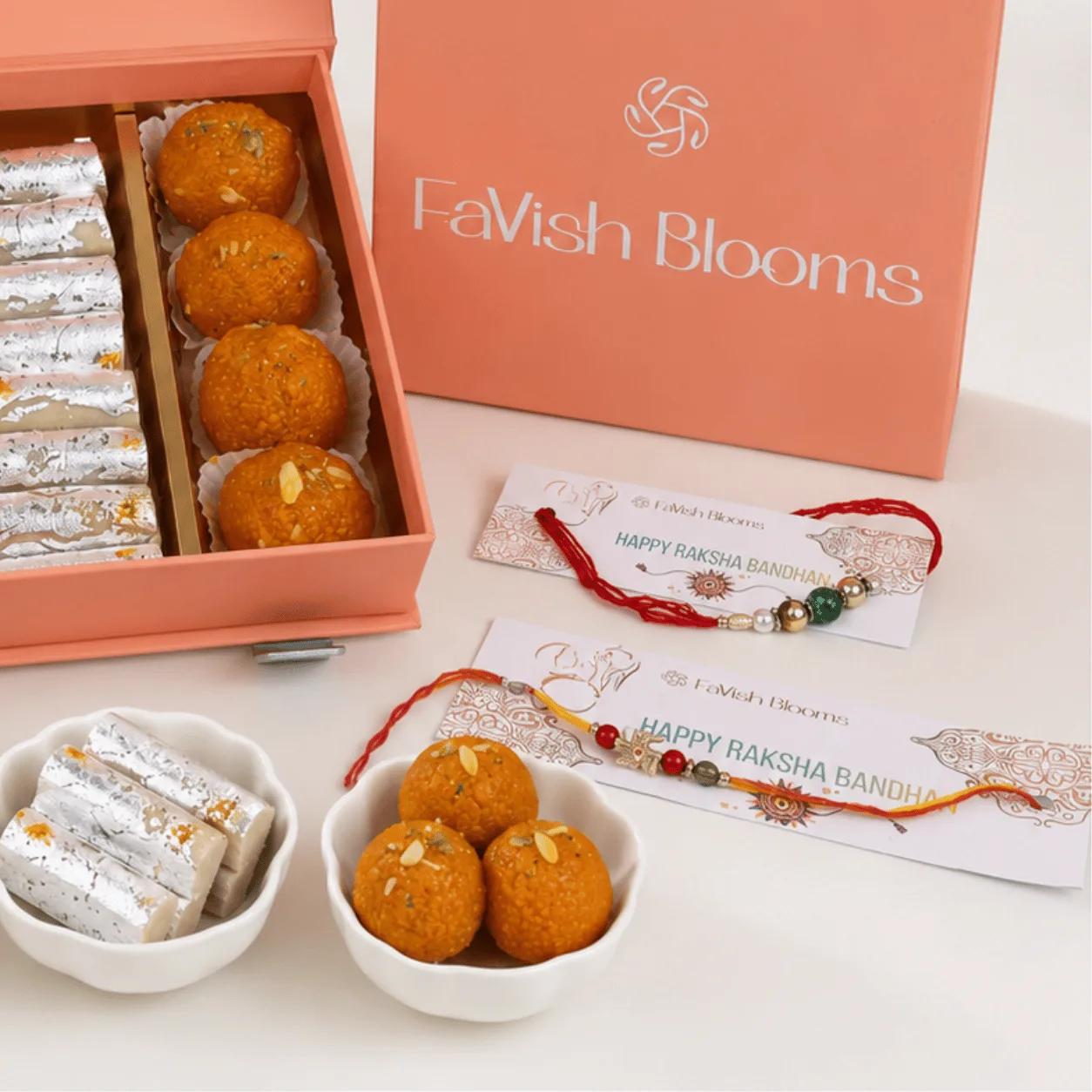Luxury Premium Rakhi Sweets & Ganesha Gift Box featuring assorted Indian sweets, decorative Ganesha idol, and Raksha Bandhan essentials