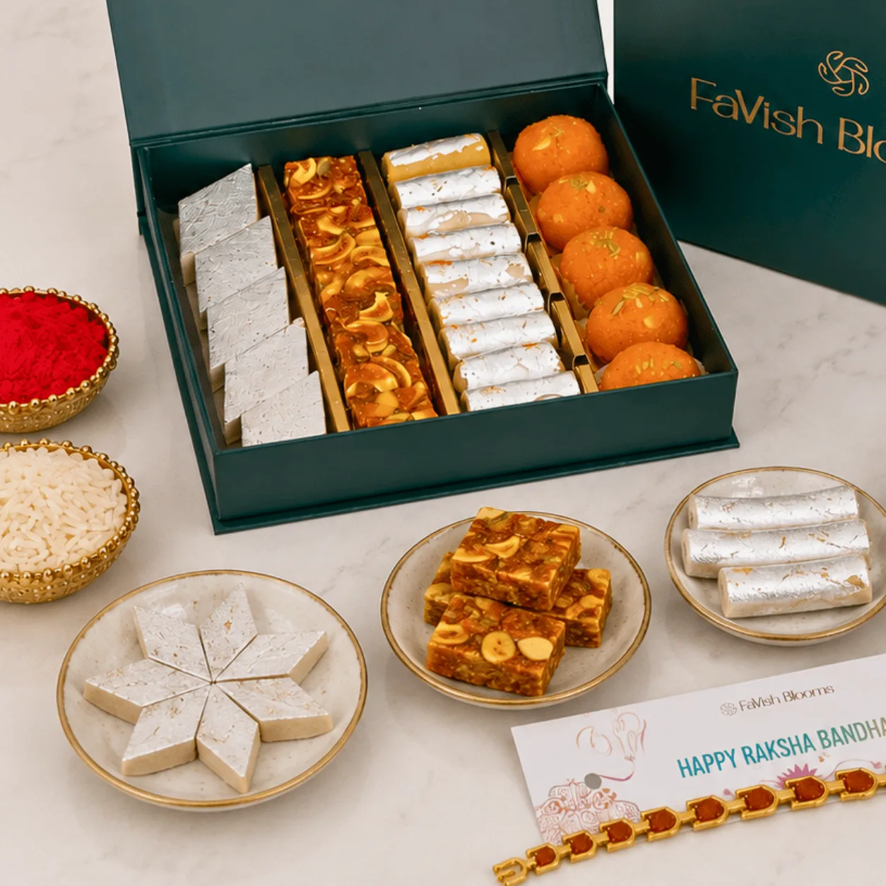 Open Festive Rakhi Sweets Gift Box with assorted sweets arranged neatly