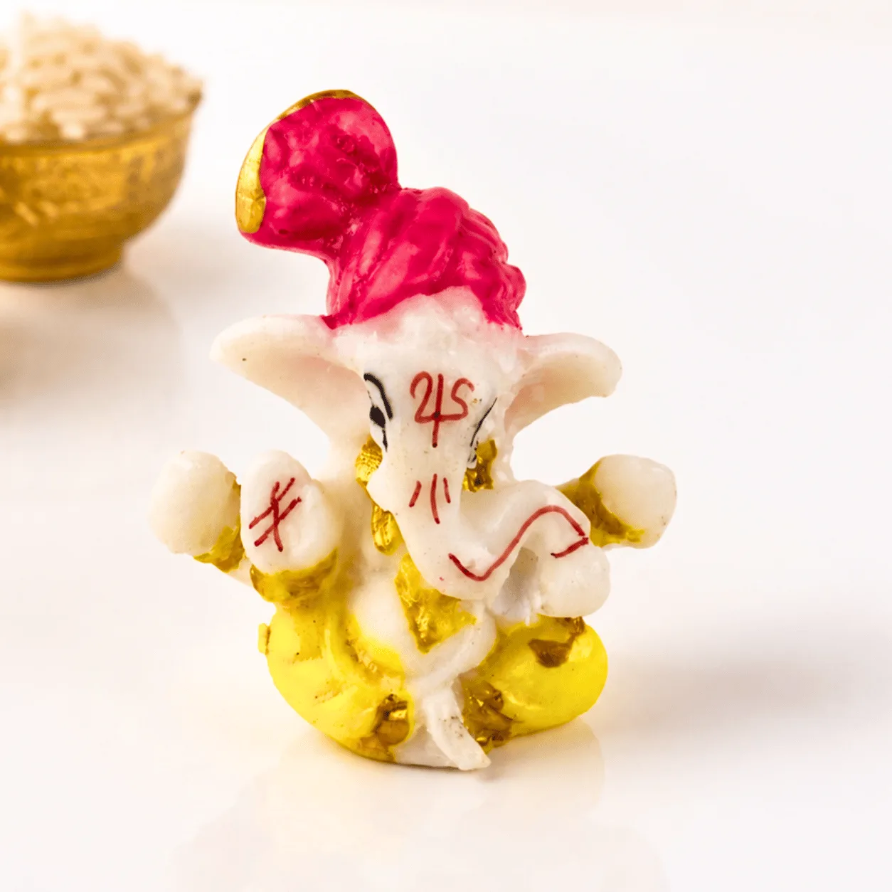 Festive Rakhi Sweets Gift Box with Bal Ganesha, kids rakhis, kumkum, and rice