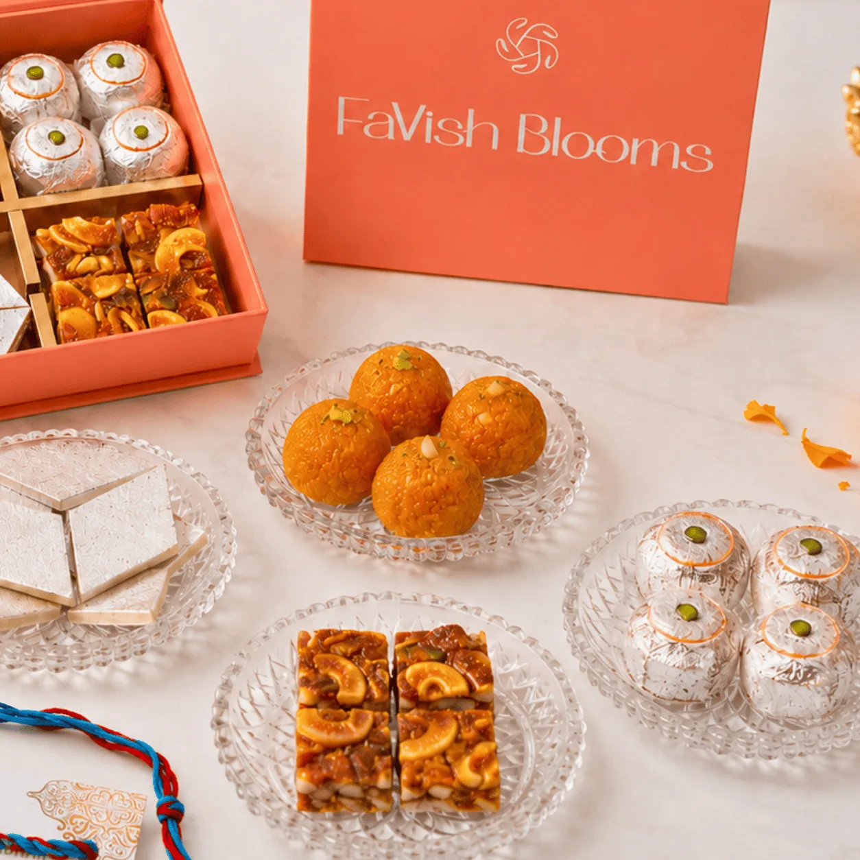 Kids Rakhi gift box featuring aeroplane and elephant themed Rakhis with mithai