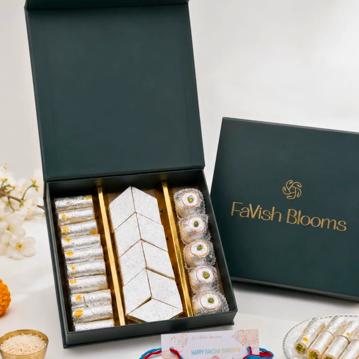 Assorted Indian sweets box with colourful kids rakhis