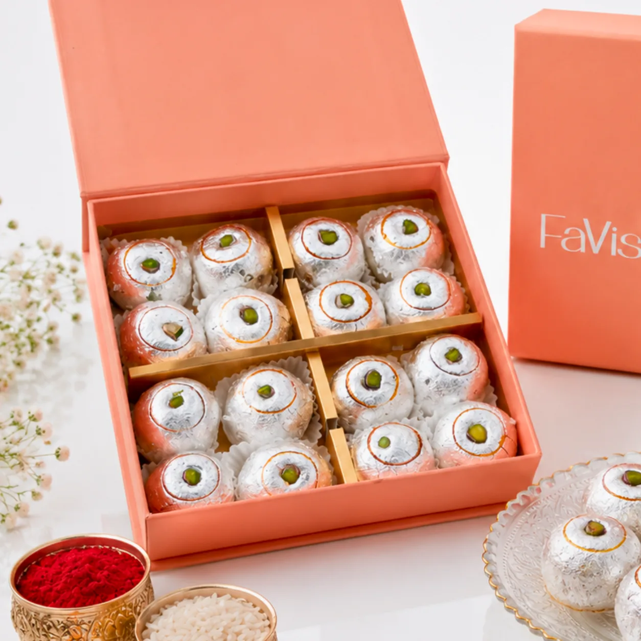Premium Rakhi gift box featuring Kaju Lemon Laddu, roli, chawal, and rakhi
