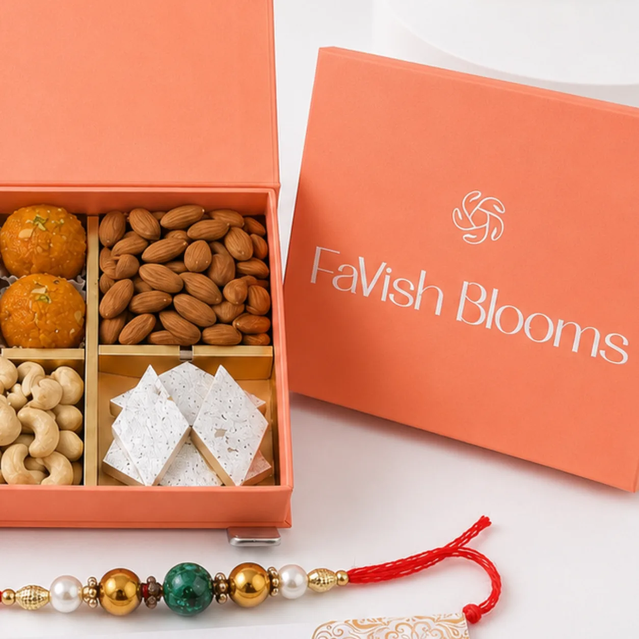 Elegant Festive Dry Fruits Hamper with 2 Rakhis, premium assorted dry fruits, traditional Rakhi set, and luxury gift box for festive gifting.
